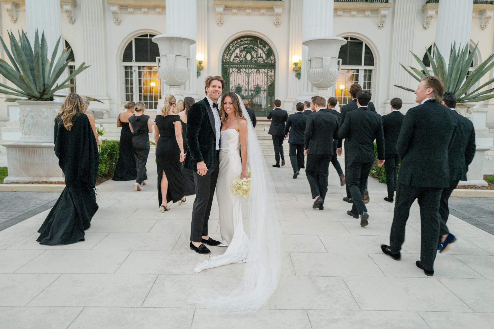Bride and Groom in front of the Flagler Museum in Palm Beach, florida